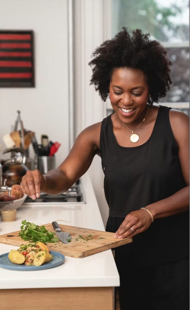 Maya Feller cooking at a kitchen counter